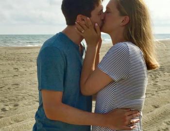 Couple celebrating an engagement on Holden Beach