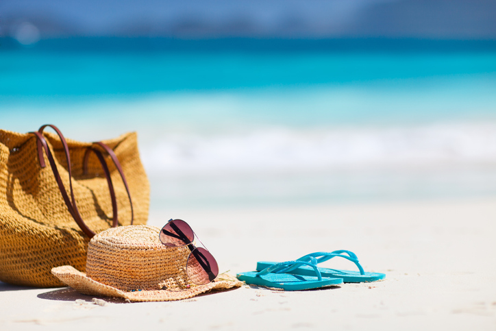 flip flops and sun hat on beach